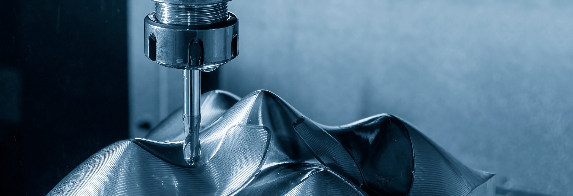 a metal milling machine cutting a metal object