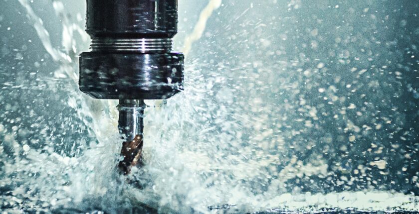 a close up of a CNC Mill splashing water