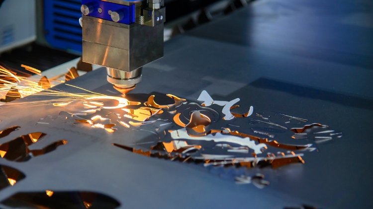 CNC EDM Machine cutting out a piece of metal