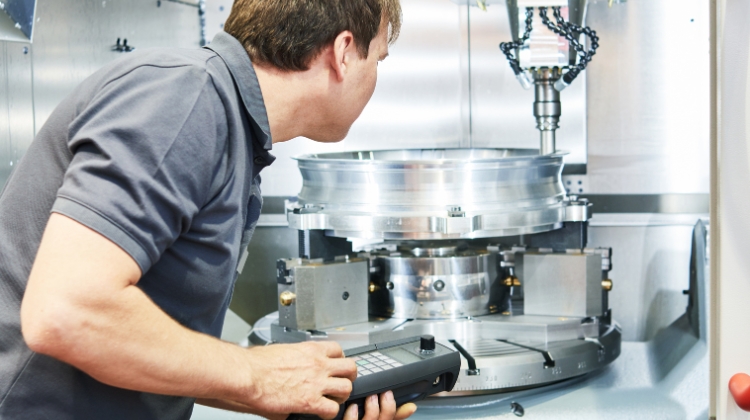 Man working on CNC Mill. Header for What Is A CNC Machine