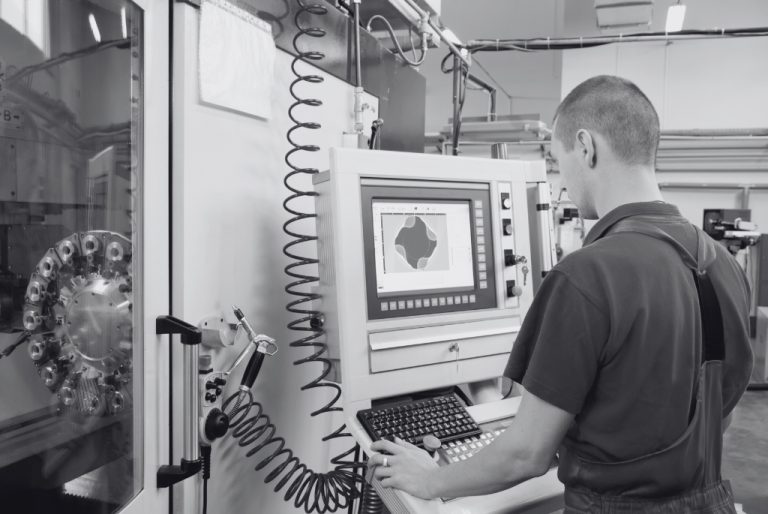 CNC Programmer Working on CNC Machine for Salary