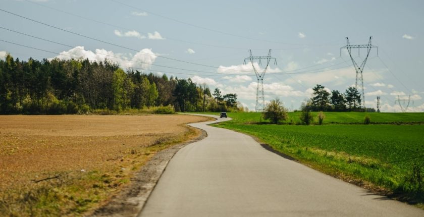 Rural open land with a path to a CNC Shop down the middle between two fields